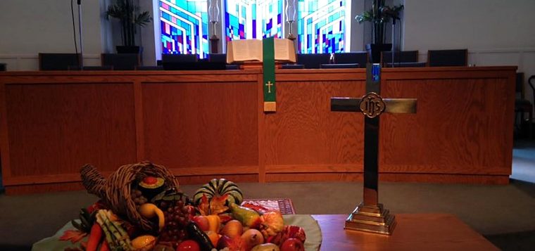 A Thanksgiving cornucopia before the chancel of McLeod Memorial