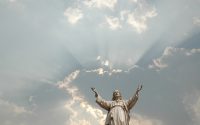 Picture of statue of Christ with arms outstretched.